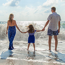 Family Hears Waves on Beach